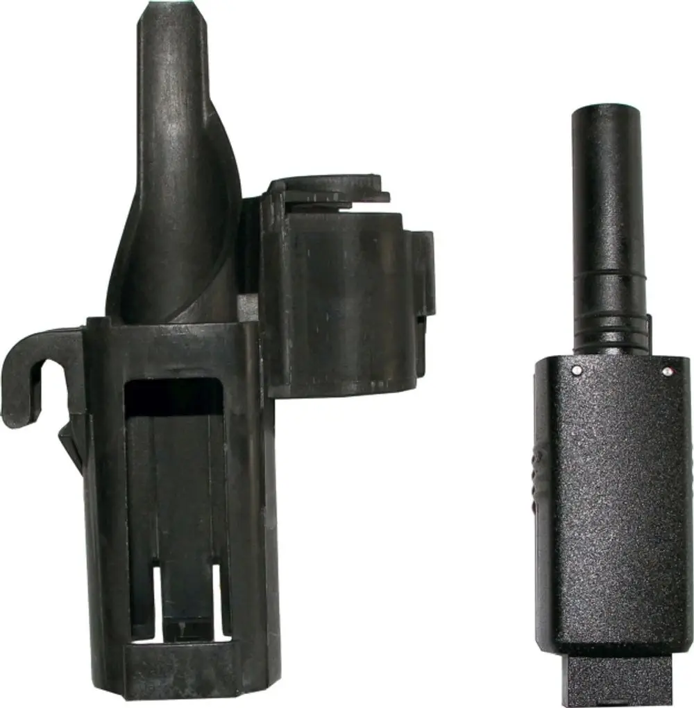 Schwarzes Kunststoffteil, das einen Sensor oder Stecker zu repräsentieren scheint, möglicherweise im Zusammenhang mit einem Wärmepumper oder Heizgerät der Marke Wolf.
